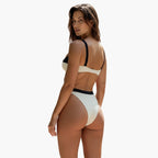 Bikini top detail showing underwired padded cups and colour block design