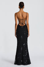 Side profile of maxi dress showing flared skirt and fitted bodice