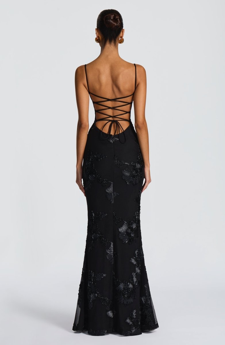 Side profile of maxi dress showing flared skirt and fitted bodice