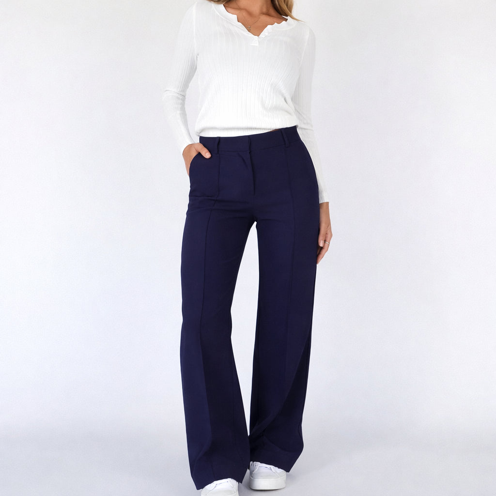Close-up of pressed front seam detail on trousers