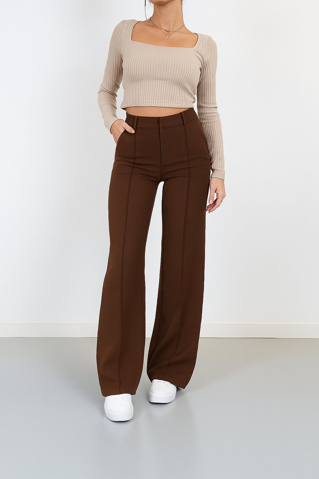 Back view of high waisted wide leg trousers on model