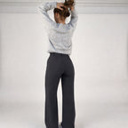 Full length back view showing trouser drape and fit
