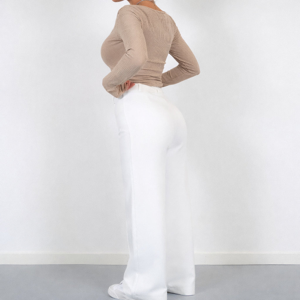 Ankle and hem detail of wide leg trousers