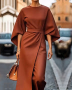 Close-up of kimono sleeve and belt fastening on midi dress