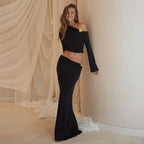 Model wearing black maxi skirt set, full length pose