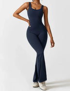 Side profile of model wearing flare leg jumpsuit