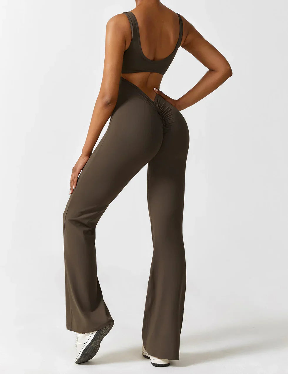 Jumpsuit worn with casual styling, standing pose