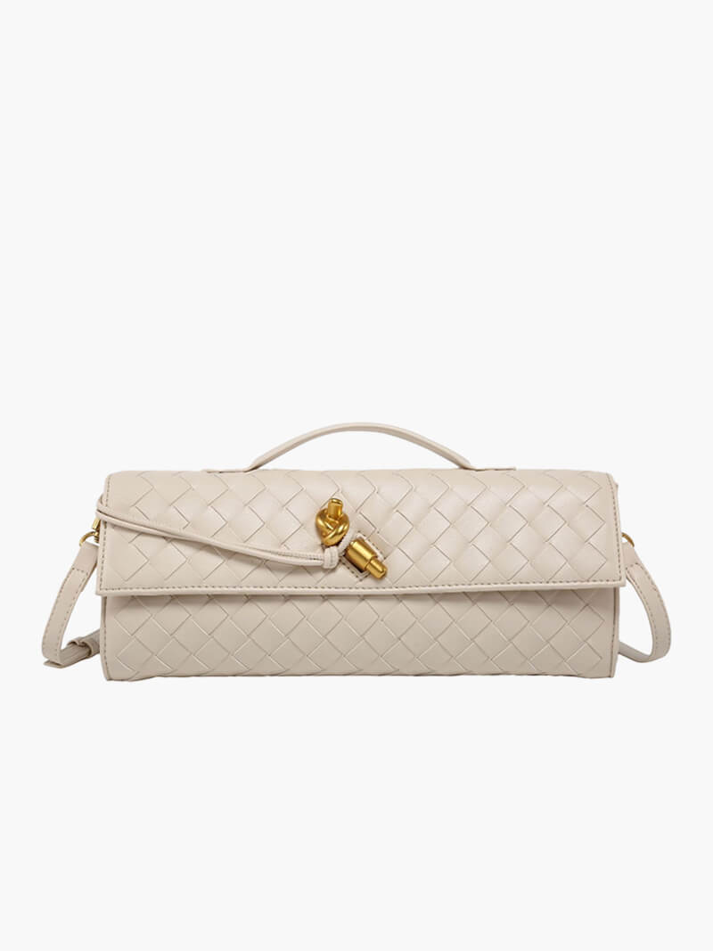 Gold-tone button fastening detail on clutch