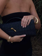 Flat lay of clutch bag showing full silhouette