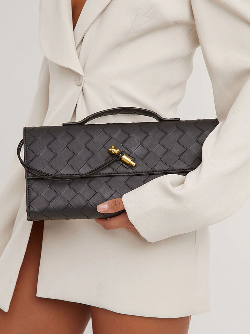 Woven leather clutch styled with neutral outfit