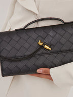 Bottom and edge detail of leather bag