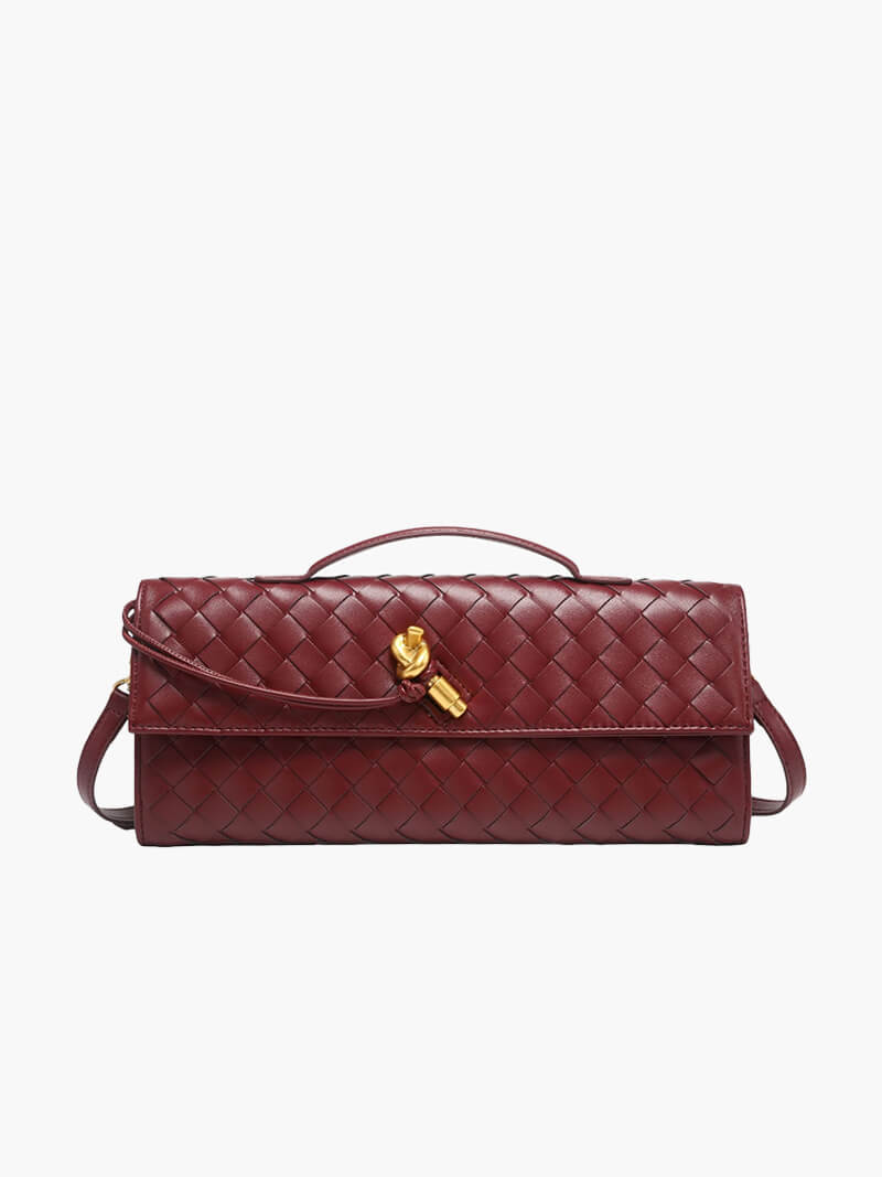 Clutch bag held by top handle, side angle