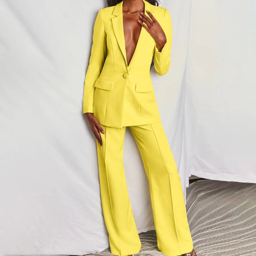 Model wearing blush pink suit, full-length standing pose