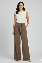 Model wearing brown palazzo trousers, standing pose full length