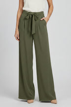 Three-quarter angle view of brown palazzo trousers on model