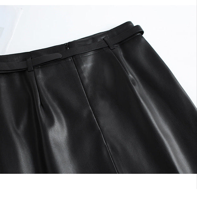 Full-length styling shot of burgundy leather pencil skirt