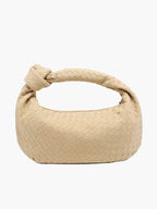 Knotted handle detail on woven shoulder bag