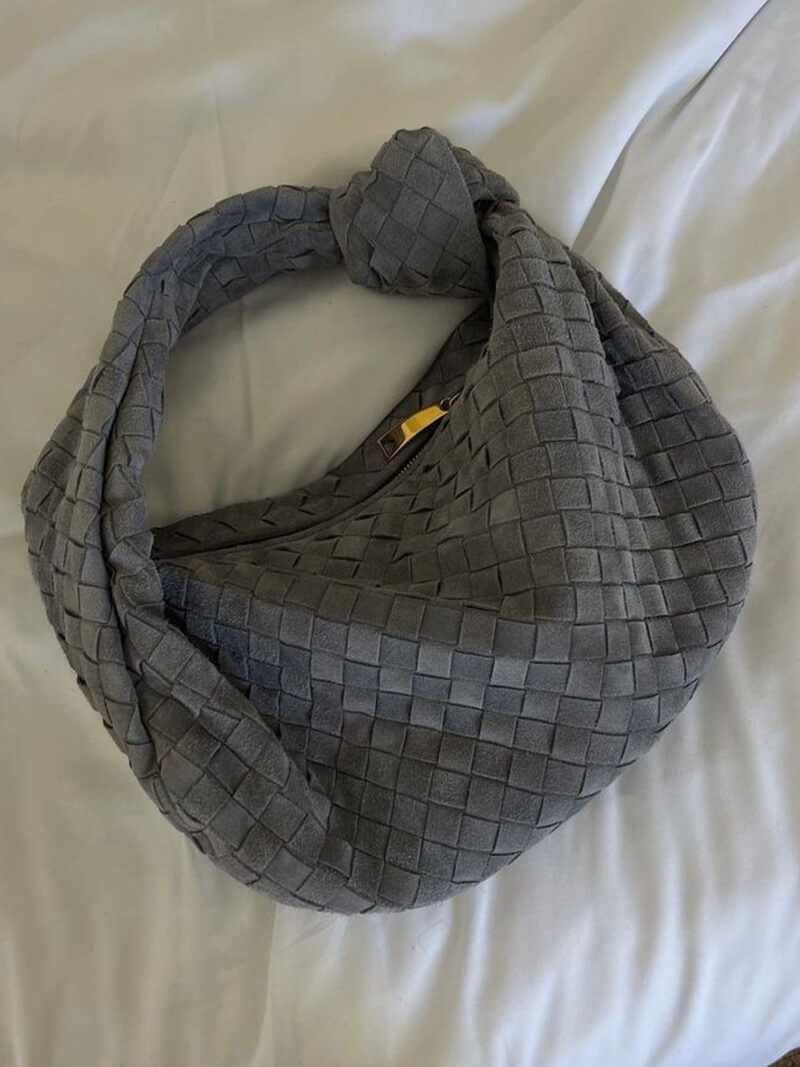 Woven bag flat lay on neutral surface