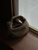 Woven bag from back angle on model