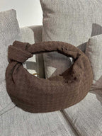 Bag opening and closure detail with woven texture