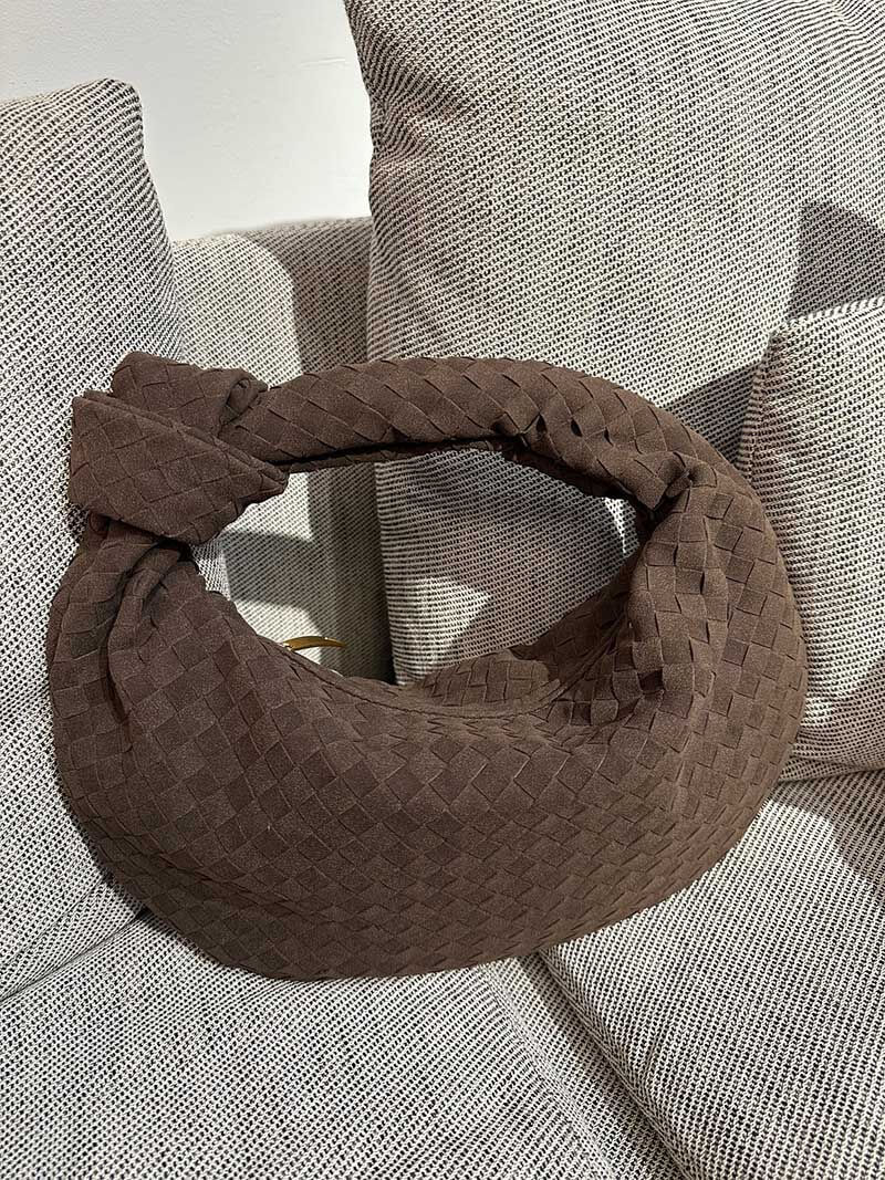 Bag opening and closure detail with woven texture
