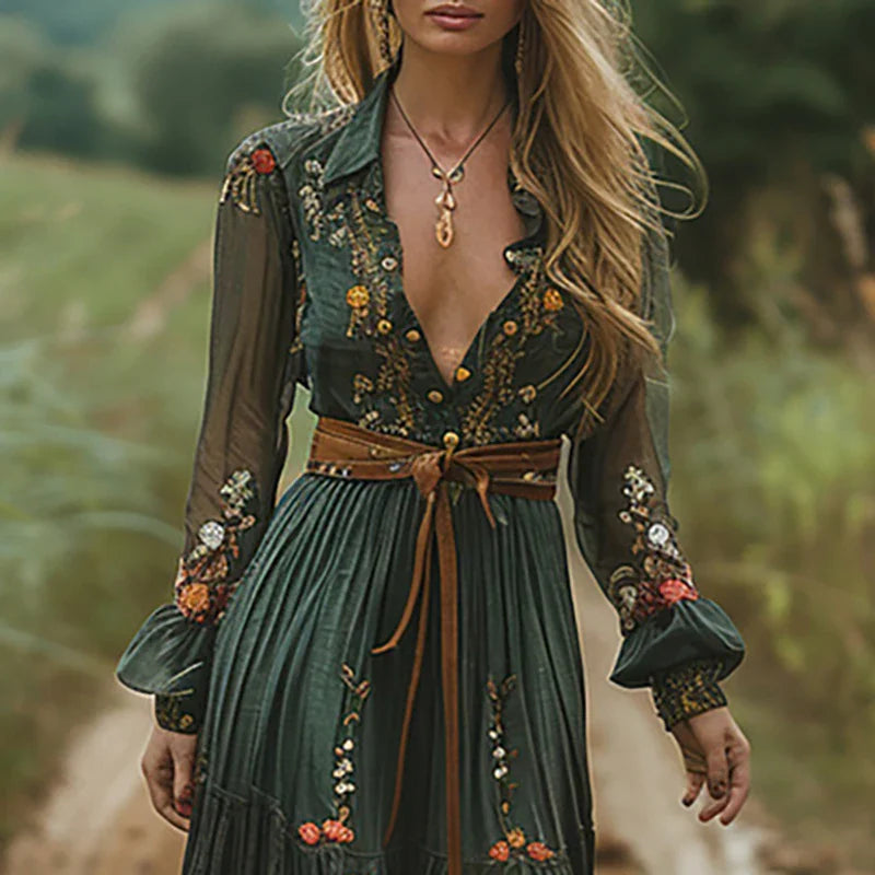 Close-up detail of delicate floral embroidery and sheer bishop sleeves