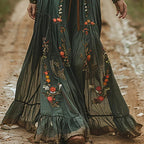 Back view showing pleated skirt and V-neckline silhouette