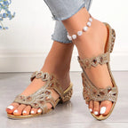 Side view of low heel sandal showing heart-shaped crystal straps
