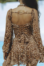 Back view of mini dress showing wrap bodice and ruffled hem