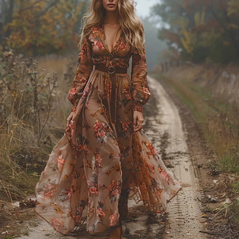 Model posing in embroidered maxi dress showing tiered skirt and drape