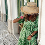 Full-length model shot wearing polka dot maxi dress outdoors