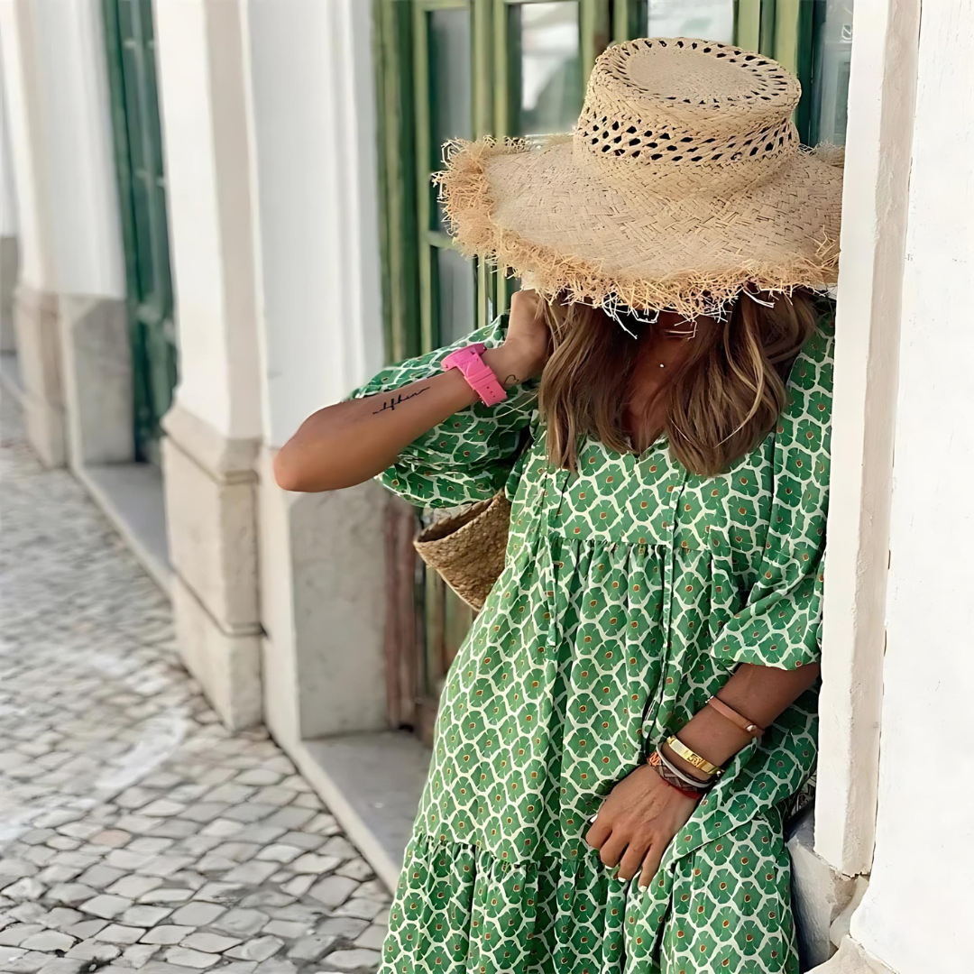 Full-length model shot wearing polka dot maxi dress outdoors