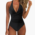 Model in swimsuit posing by poolside