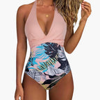 Model diving into pool wearing striped one-piece
