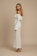 Model wearing ivory lace maxi dress, full-length side profile pose