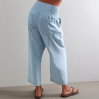 Overhead flat lay of folded trousers