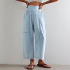 Model in motion, dynamic pose wearing trousers