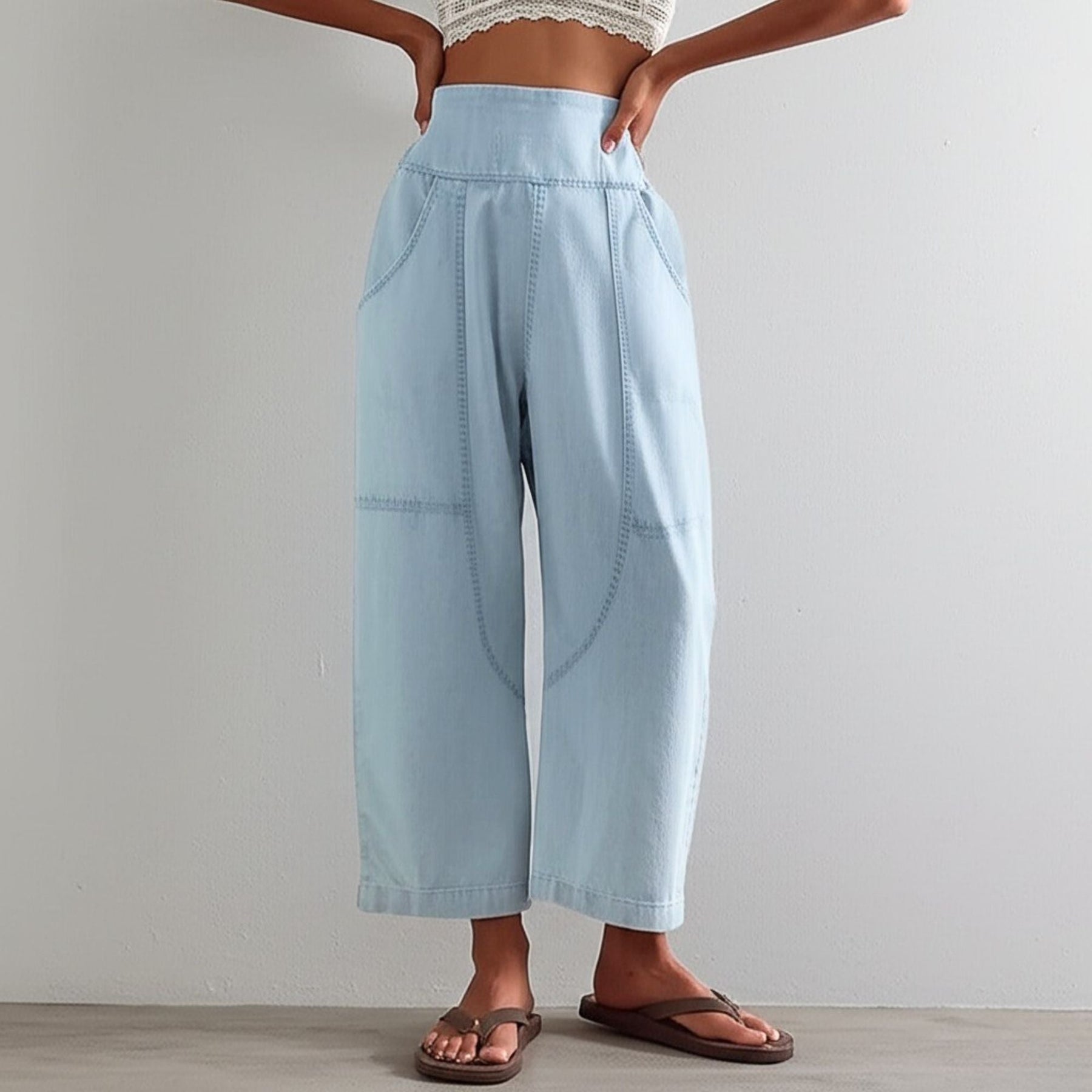 Model in motion, dynamic pose wearing trousers