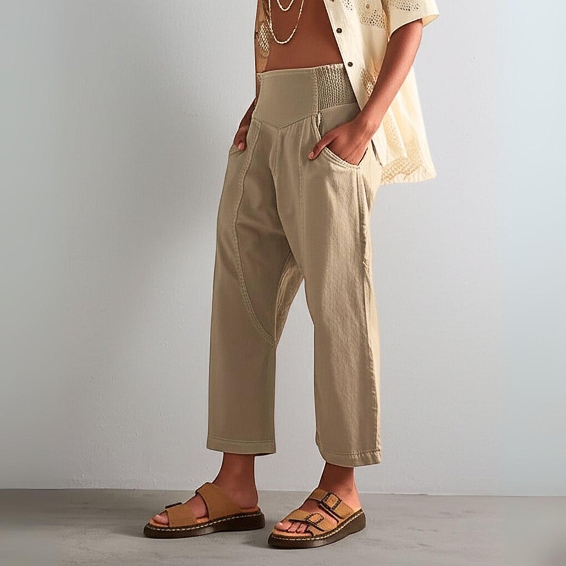 Model wearing trousers, three-quarter length pose