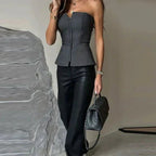 Side view of strapless corset top with peplum hem and fitted waist