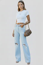 Side angle view of high waist wide leg jeans showing silhouette and fit