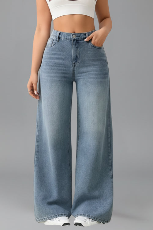 Model wearing light blue wide leg jeans, full-length standing pose