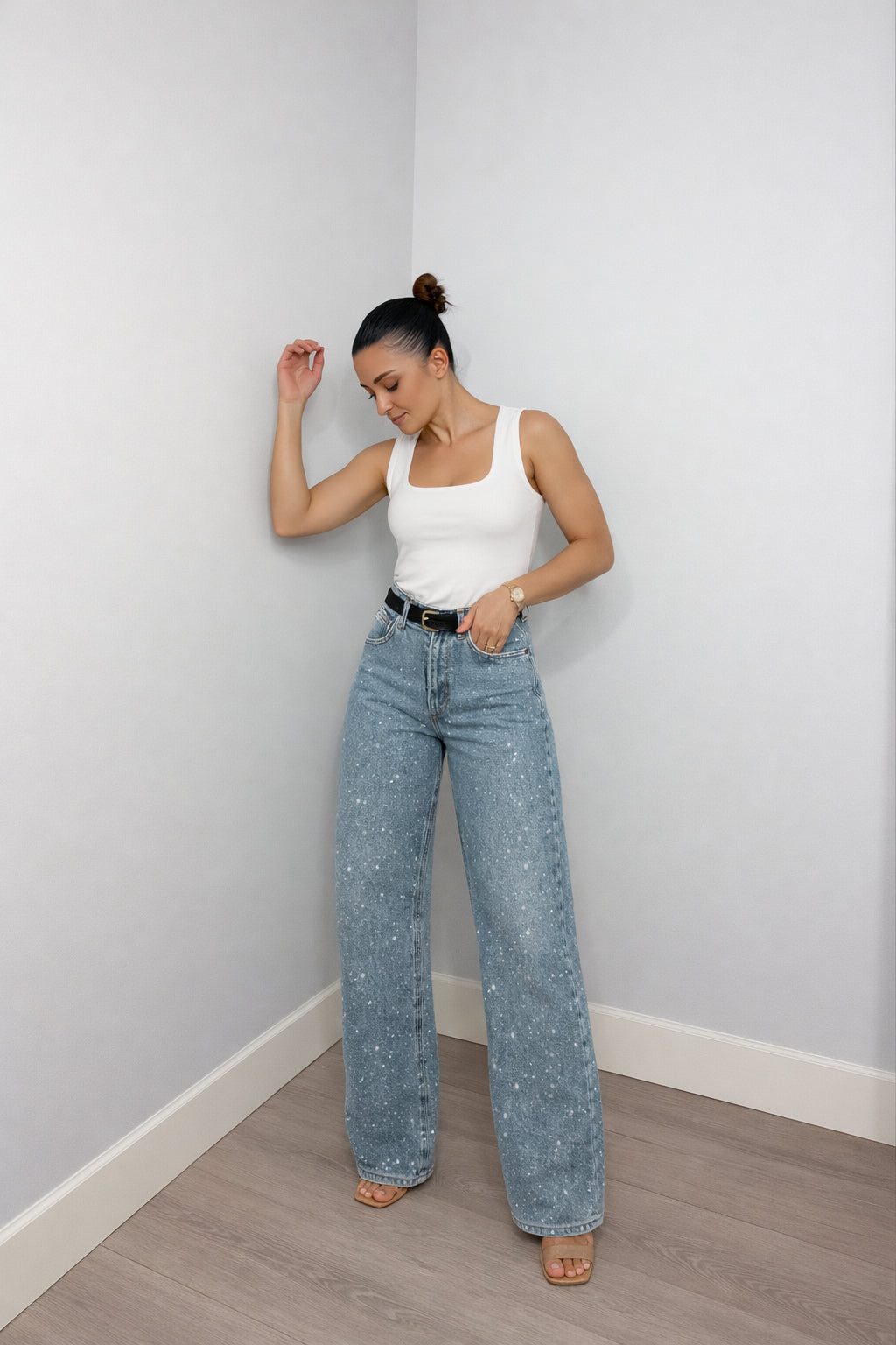 Women's high waisted wide leg glitter jeans in washed blue, front view