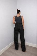 Rear view of high waisted wide leg jeans showing back pockets