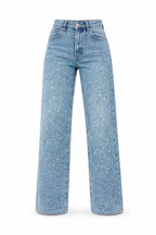 Model wearing glitter jeans, standing relaxed pose