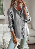 Full-length view of model wearing blouse styled with skirt