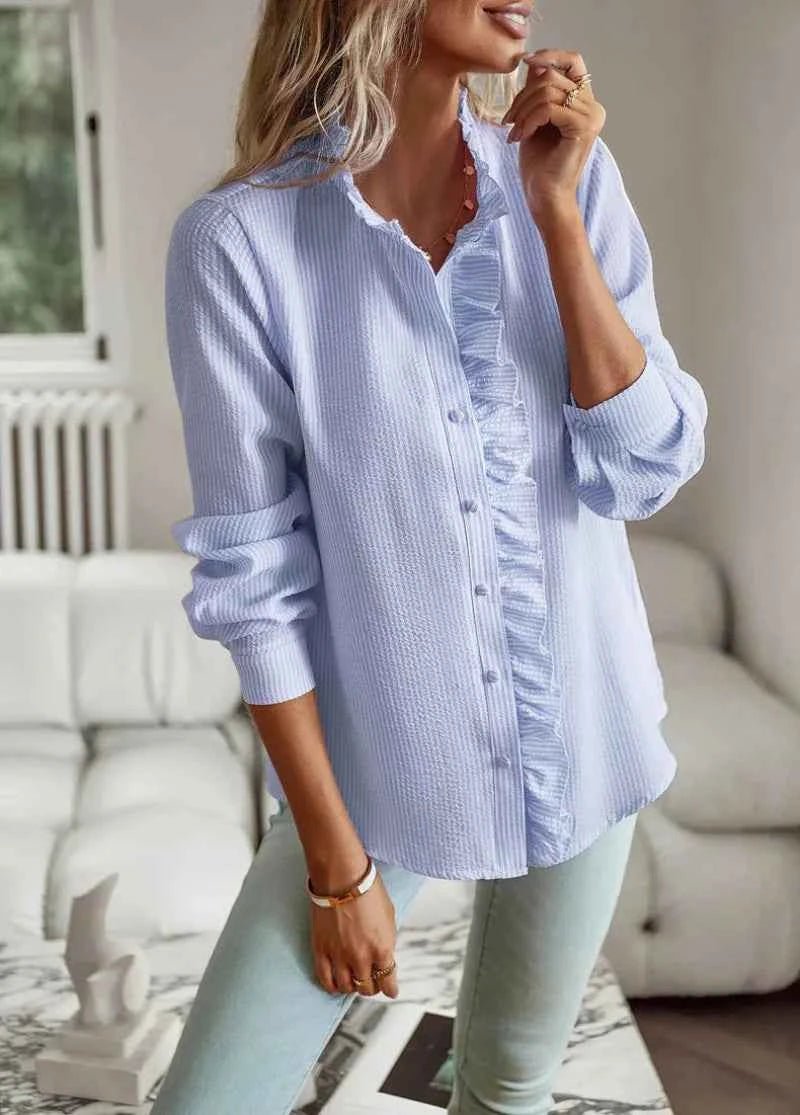 Back view of blouse, showing structured collar from rear