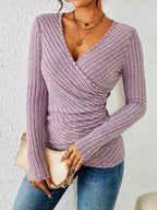 Model wearing lilac wrap top, side profile showing ruched detail