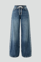 Medium blue wide leg jeans with drawstring waist, front view on flat background