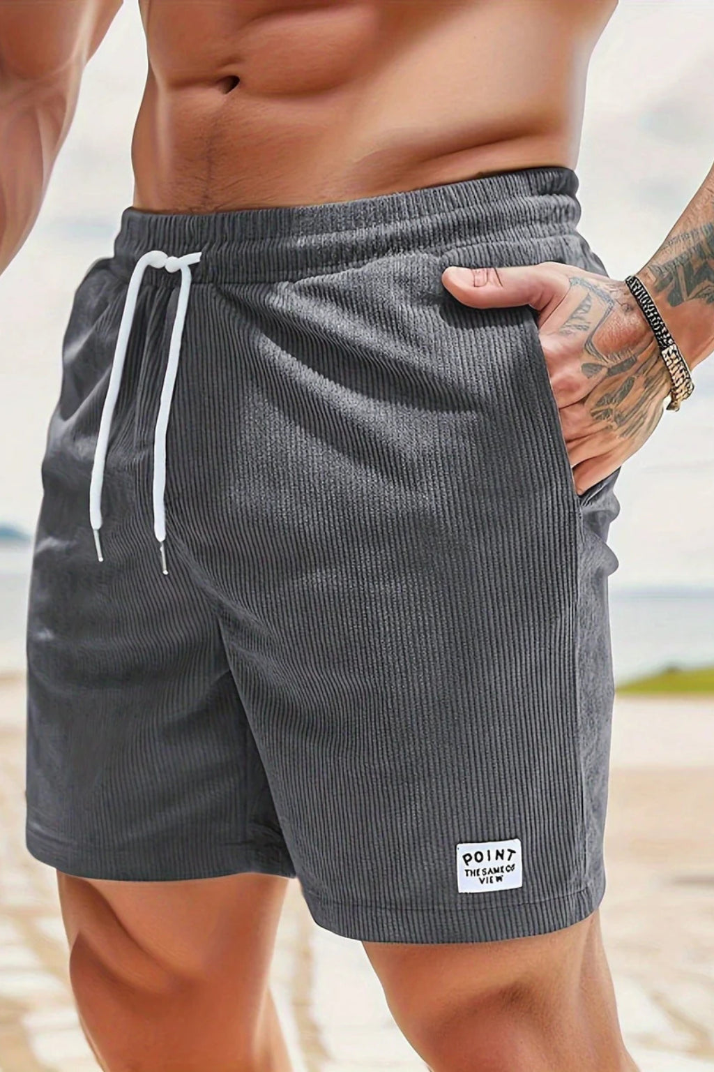 Model walking in relaxed drawstring shorts
